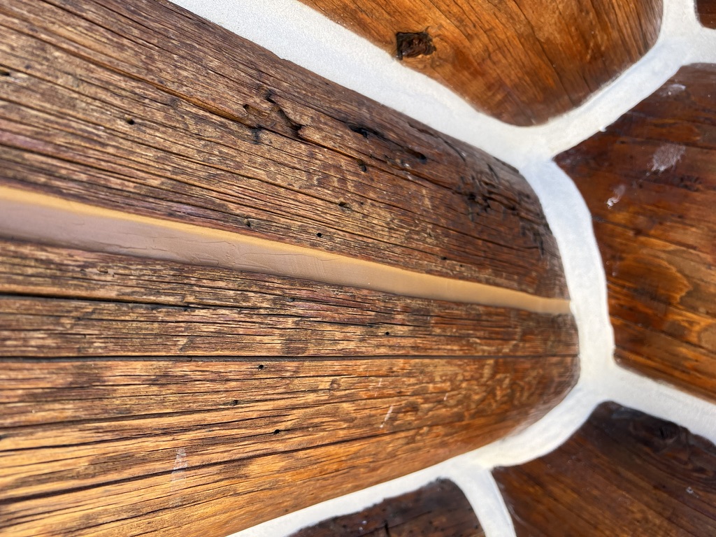 Close-up of fresh chinking between log courses