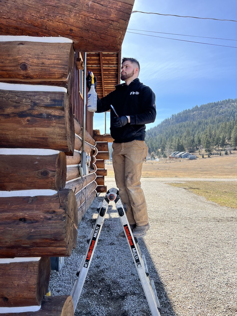 Professional log home chinking and staining on-site